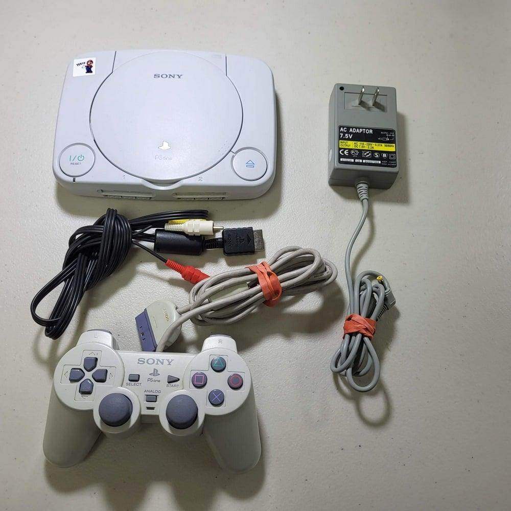 White Console PlayStation System PS1 Slim (Dualshock) -- Jeux Video Hobby 