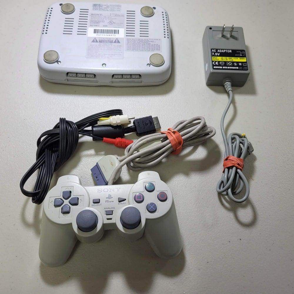 White Console PlayStation System PS1 Slim (Dualshock) -- Jeux Video Hobby 